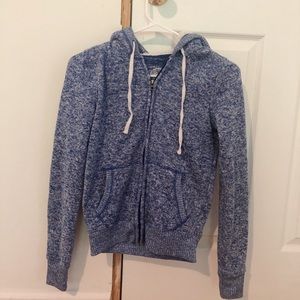 blue zip-up sweater